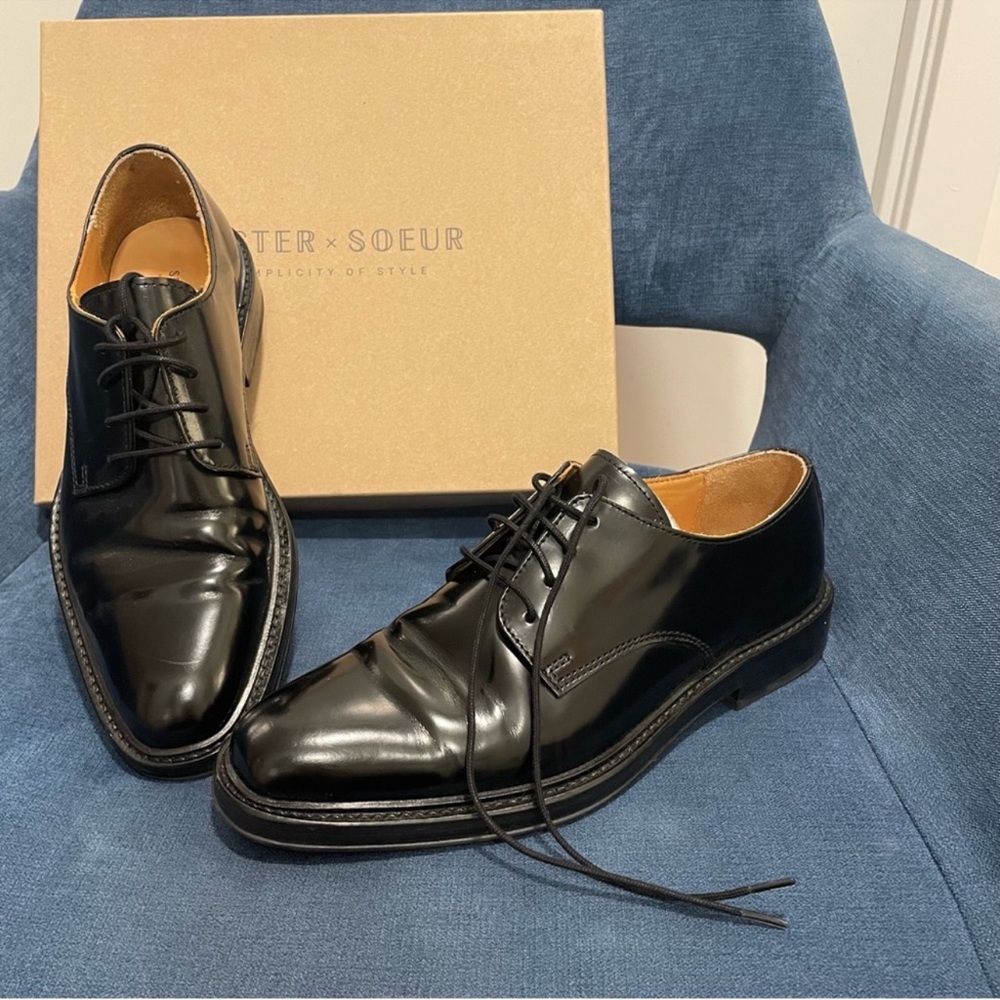 Sister Soeur black patent leather Oxford shoes.